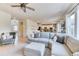 Bright and airy living room flowing into the kitchen area with modern finishes at 15389 W 50Th Dr, Golden, CO 80403