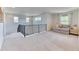 The loft area provides extra living space with soft carpeting and natural light from the windows at 15389 W 50Th Dr, Golden, CO 80403
