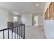 This loft area offers versatile space, bright natural light, neutral walls, and easy access to the laundry room at 15389 W 50Th Dr, Golden, CO 80403