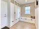 Well-organized mud room with custom storage, bench, and natural lighting at 15389 W 50Th Dr, Golden, CO 80403