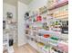 Organized walk-in pantry with ample shelving for storage and convenient access at 15389 W 50Th Dr, Golden, CO 80403
