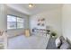 Sunlit playroom featuring built-in shelving and ample space for activities at 15389 W 50Th Dr, Golden, CO 80403