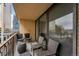 Relaxing balcony seating with beautiful city views and sliding glass doors at 1020 15Th St # 9N, Denver, CO 80202