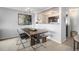 Open floorplan living with view of kitchen and art at 1020 15Th St # 9N, Denver, CO 80202