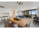 Bright open-concept living room and dining area with mountain views from the balcony at 1020 15Th St # 9N, Denver, CO 80202