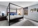 Bright bedroom featuring a four-poster bed, modern nightstands and accent lighting at 1020 15Th St # 9N, Denver, CO 80202
