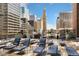 Relaxing rooftop deck with lounge chairs and city skyline views for ultimate outdoor enjoyment at 1020 15Th St # 9N, Denver, CO 80202