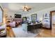 Bright living room featuring a fireplace and ample natural light at 4336 Thompson Ct, Denver, CO 80216