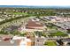 Beautiful aerial view of a community with shopping centers, a golf course, and mountains in the background at 10241 Bellwether Ln, Lone Tree, CO 80124
