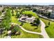 Aerial view of neighborhood park with a playground, trails, and picnic area at 10241 Bellwether Ln, Lone Tree, CO 80124