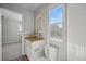 Well-lit bathroom featuring vessel sink, granite countertop, and walk-in shower at 10241 Bellwether Ln, Lone Tree, CO 80124