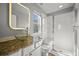 Modern bathroom with vessel sink, granite countertop, and glass-enclosed shower at 10241 Bellwether Ln, Lone Tree, CO 80124