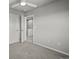 Bedroom with neutral carpet, ceiling fan, and open doorway into the hallway at 10241 Bellwether Ln, Lone Tree, CO 80124