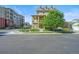 Multi-story townhome showcases a double balcony, brick accents, and inviting outdoor space at 10241 Bellwether Ln, Lone Tree, CO 80124