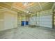 Attached two car garage with unfinished walls and door to the exterior at 10241 Bellwether Ln, Lone Tree, CO 80124