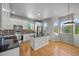 Bright kitchen with stainless appliances, granite countertops, mosaic backsplash, and hardwood floors at 10241 Bellwether Ln, Lone Tree, CO 80124