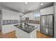 Updated kitchen featuring stainless appliances, granite countertops, and mosaic backsplash at 10241 Bellwether Ln, Lone Tree, CO 80124
