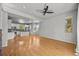 Light-filled living space offering hardwood floors, neutral paint, and a stylish kitchen with an island at 10241 Bellwether Ln, Lone Tree, CO 80124