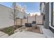 Cozy backyard patio with a seating area, privacy fence, and clean design at 1660 Utica St, Denver, CO 80204