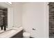 Modern bathroom featuring a sleek vanity, contemporary fixtures, and stylish dark gray subway tile in the shower at 1660 Utica St, Denver, CO 80204
