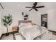 Stylish bedroom showcases a ceiling fan, a decorative rug, and elegant furnishings at 1660 Utica St, Denver, CO 80204