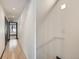 Hallway featuring hardwood flooring and staircase boasts modern minimalist design at 1660 Utica St, Denver, CO 80204