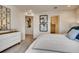 Main bedroom with ensuite bathroom, closet, neutral décor, and carpeted floor at 6570 Parterre N Pkwy # 2, Thornton, CO 80602