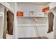 Bright walk-in closet with organizers and carpet flooring at 6570 Parterre N Pkwy # 2, Thornton, CO 80602