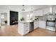 Modern kitchen boasts granite countertops, stainless steel appliances, and a stylish island at 558 S Field Ct, Lakewood, CO 80226