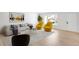 Bright living room featuring hardwood floors, natural light, and stylish contemporary furniture at 558 S Field Ct, Lakewood, CO 80226