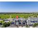 Stunning aerial view of modern townhomes, featuring solar panels and access to a large, green park area at 9158 Martin Luther King Blvd, Denver, CO 80238