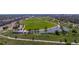 Beautiful aerial view of a large park with a pond, walking trails, and green spaces for recreation at 9158 Martin Luther King Blvd, Denver, CO 80238