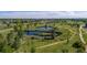 Overhead view of greenways including a tranquil pond, pathways, and lush greenery for outdoor enjoyment at 9158 Martin Luther King Blvd, Denver, CO 80238