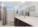 Stylish bathroom with quartz countertop vanity, tile flooring, and shower-tub combination at 9158 Martin Luther King Blvd, Denver, CO 80238