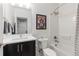 Neat bathroom with modern vanity, stylish fixtures, and shower-tub combination at 9158 Martin Luther King Blvd, Denver, CO 80238