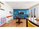 Entertaining game room with colorful decor, custom features, and wood flooring at 9158 Martin Luther King Blvd, Denver, CO 80238
