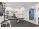 Bright home gym with mirrored wall, exercise equipment, and rubber flooring at 9158 Martin Luther King Blvd, Denver, CO 80238