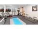 Well-equipped home gym with exercise equipment and ample workout space at 9158 Martin Luther King Blvd, Denver, CO 80238
