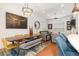 Spacious living area with hardwood floors, modern lighting, and a contemporary dining set at 9158 Martin Luther King Blvd, Denver, CO 80238