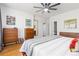 Spacious main bedroom with hardwood floors, modern dressers, and a serene ambiance at 9158 Martin Luther King Blvd, Denver, CO 80238