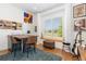 Bright and cozy office space with a large window, hardwood floors, and stylish decor at 9158 Martin Luther King Blvd, Denver, CO 80238