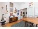 Versatile office space with wood floors, desk, and musical instruments adorning the walls at 9158 Martin Luther King Blvd, Denver, CO 80238