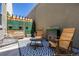 Inviting patio area with comfortable rocking chairs and modern black and white rug, perfect for outdoor relaxing at 9158 Martin Luther King Blvd, Denver, CO 80238