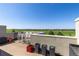 Outdoor rooftop deck space perfect for entertaining with seating and a great view at 9158 Martin Luther King Blvd, Denver, CO 80238