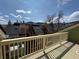 Exterior view from a deck showcasing townhouses, scenic mountains in the background, and a blue sky at 3025 Broadway St # 17, Boulder, CO 80304