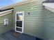 View of the green townhouse front door with a screen and the number 17 to enhance appeal at 3025 Broadway St # 17, Boulder, CO 80304