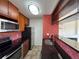 Kitchen featuring wood cabinets, a stainless-steel oven and microwave, and a red tile backsplash at 3025 Broadway St # 17, Boulder, CO 80304