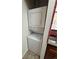 Convenient laundry area featuring stacked washer and dryer in a compact space at 3025 Broadway St # 17, Boulder, CO 80304
