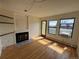 Inviting living room featuring a fireplace, hardwood floors, and natural light at 3025 Broadway St # 17, Boulder, CO 80304