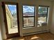 Bright living room with light wood floors, balcony access, and mountain views at 3025 Broadway St # 17, Boulder, CO 80304